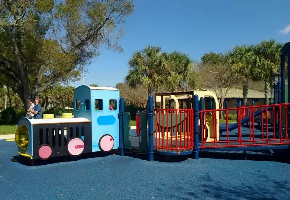 Park on a lake with a ton of playgrounds side by side, and a splash pad!