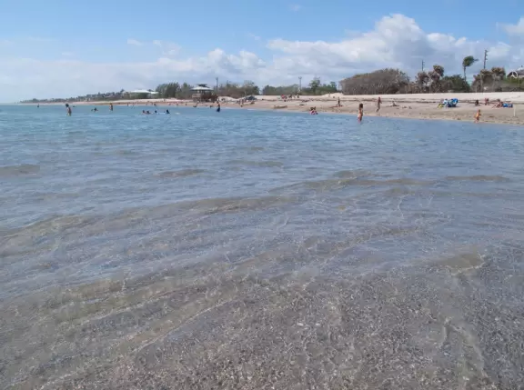 Ultra-shallow clear waters protected by a reef make this a perfect swimming spot for very young children.