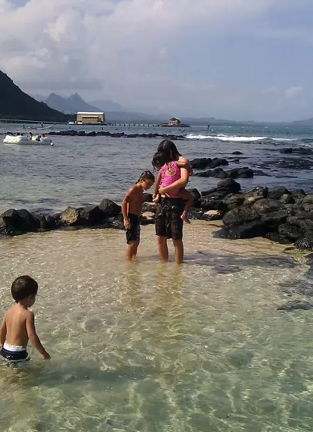 A great place to learn to surf! Plus sparkling shallow tide pools for little kids.